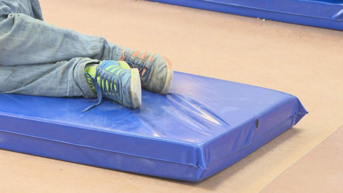 A guest at the Lethbridge Wellness Shelter and Stabilization Centre takes a rest. The Blood Tribe Department of Health gave Global News a tour of the facility on April 17, 2023.