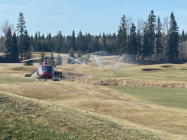 Parkland County fire crews going over their plan Monday, May 1, 2023, at Trestle Creek golf course where their command centre is.