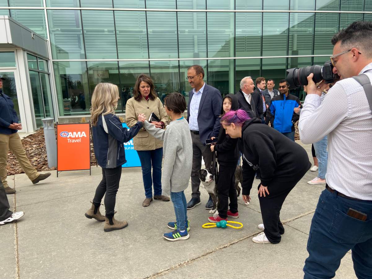 Alberta NDP leader Rachel Notley and UCP leader Danielle Smith meet wildfire evacuees at the Edmonton EXPO centre on Sunday May 7, 2023.