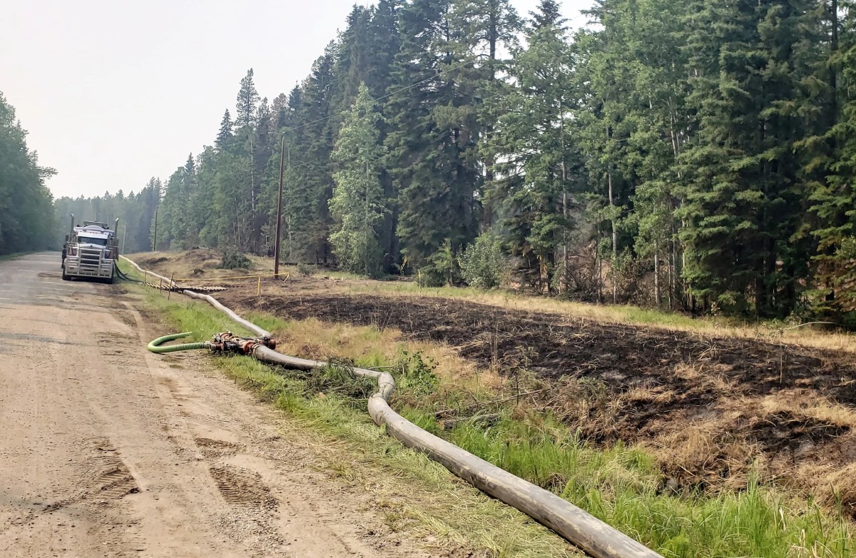 High-flow water pumps being installed to fight the wildfire near Edson, Alta. on June 12, 2023.
