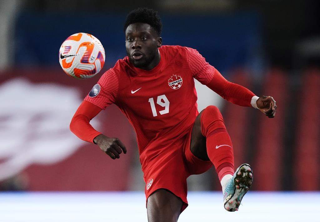 Canada midfielder Alphonso Davies (19) controls the ball against Honduras during first half CONCACAF Nations League soccer action in Toronto on Tuesday, March 28, 2023.
