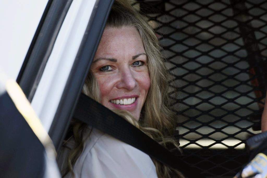 FILE - Lori Vallow Daybell sits in a police car after a hearing at the Fremont County Courthouse in St. Anthony, Idaho, on Aug. 16, 2022.