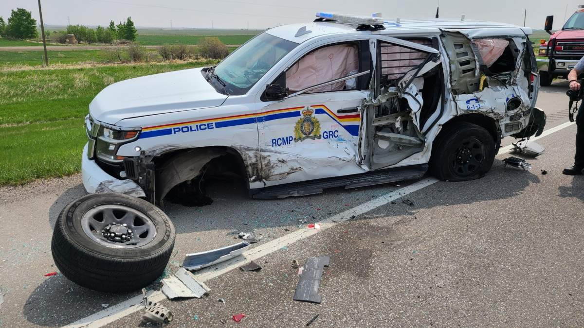 A damaged RCMP unit after it was struck by a semi near Stavely, Alta. (Supplied: RCMP)