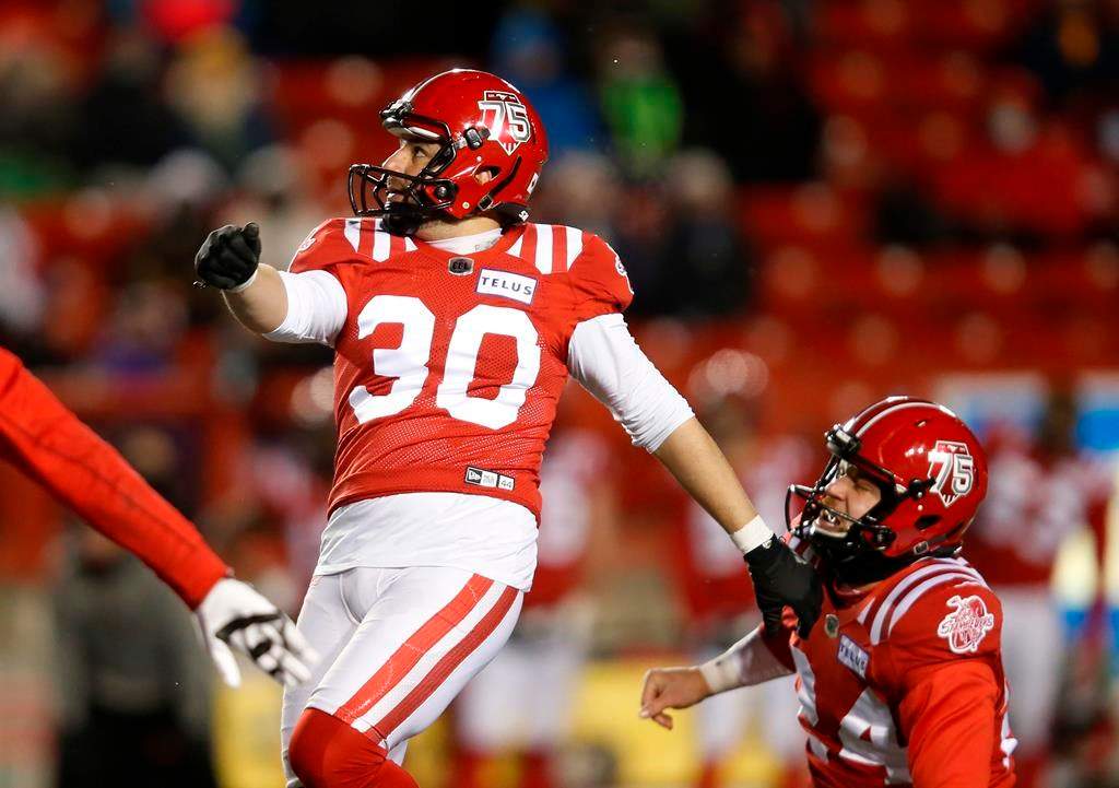 The Calgary Stampeders' Rene Paredes watches his game-winning field goal with Cody Grace against the Winnipeg Blue Bombers during the second half of their CFL football game in Calgary on November 20, 2021.