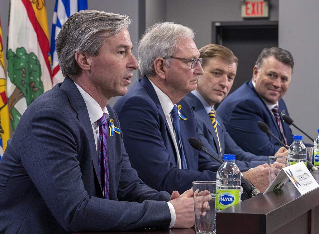 Nova Scotia Premier Tim Houston, New Brunswick Premier Blaine Higgs, Newfoundland and Labrador Premier Andrew Furey and Prince Edward Island Premier Dennis King, left to right, field questions at the closing news conference at a meeting of the Council of Atlantic Premiers in Halifax on March 21, 2022. An environmentalist in New Brunswick says Atlantic premiers are using scaremongering tactics in their call for Ottawa to delay rules requiring refineries to reduce carbon in diesel and gasoline they produce. THE CANADIAN PRESS/Andrew Vaughan.