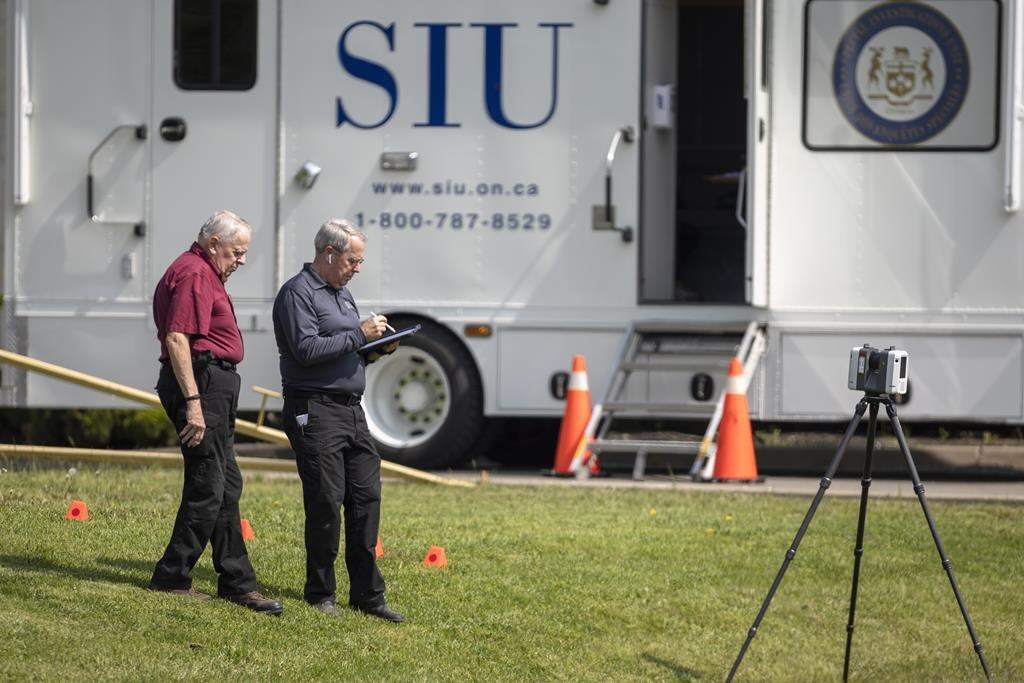 Members of the Special Investigations Unit (SIU) at the scene of an investigation. 