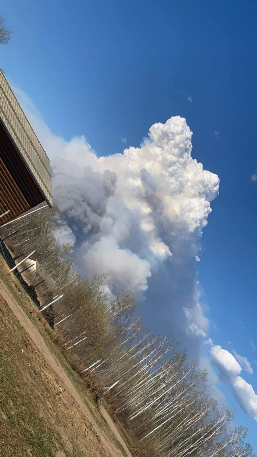 Photo of smoke taken as a wildfire burns out of control near Fox Lake in northern Alberta.