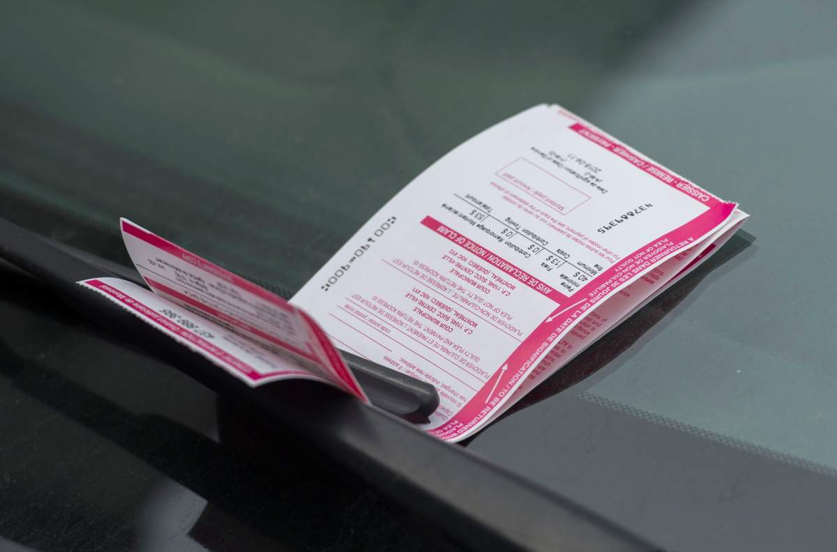 A parking ticket is shown on a car in Montreal, Wednesday, April 11, 2018.