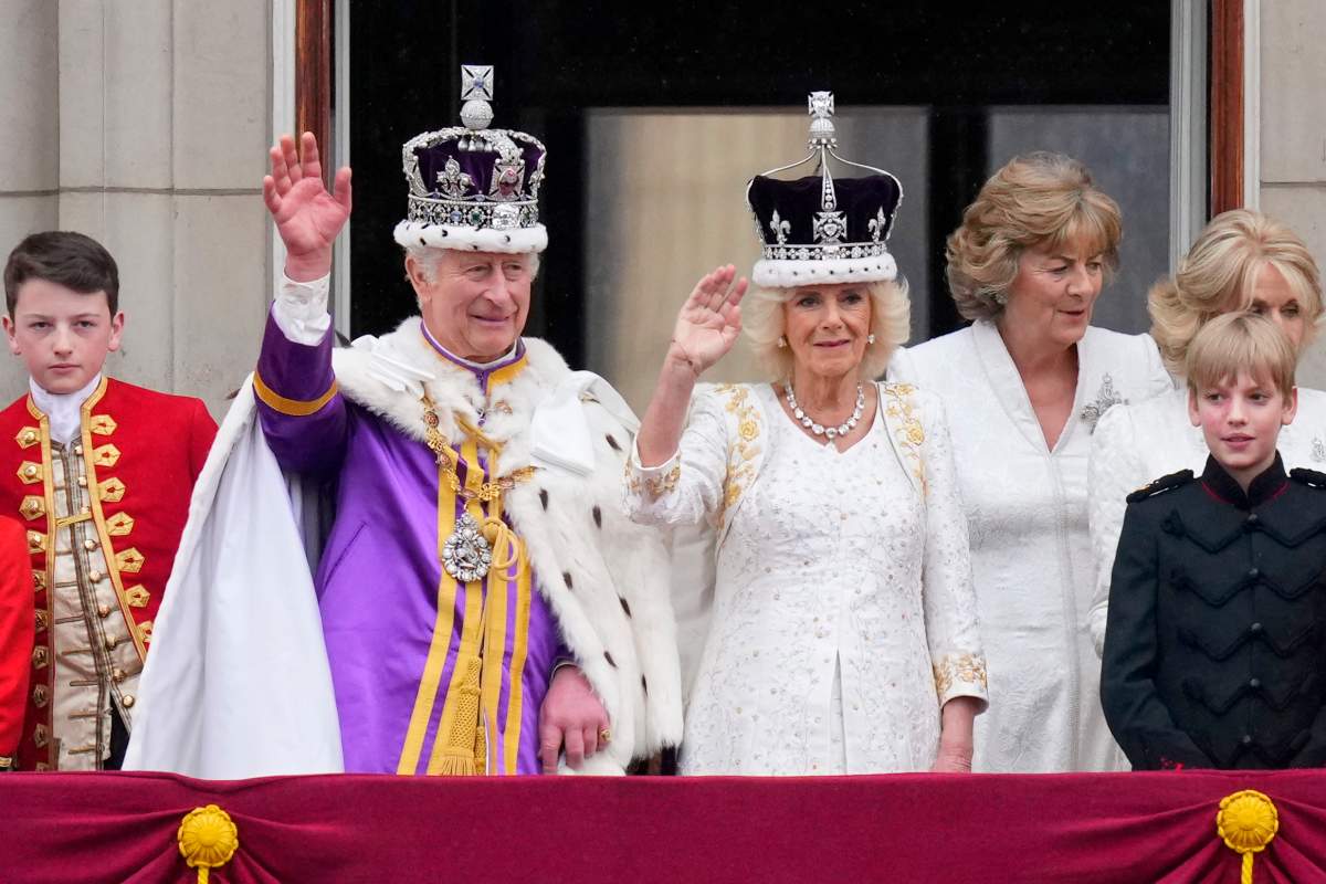 Britain’s King Charles III and Queen Camilla wave to the crowds from the balcony of Buckingham Palace after their coronation ceremony, in London, Saturday, May 6, 2023. (AP Photo/Petr David Josek)