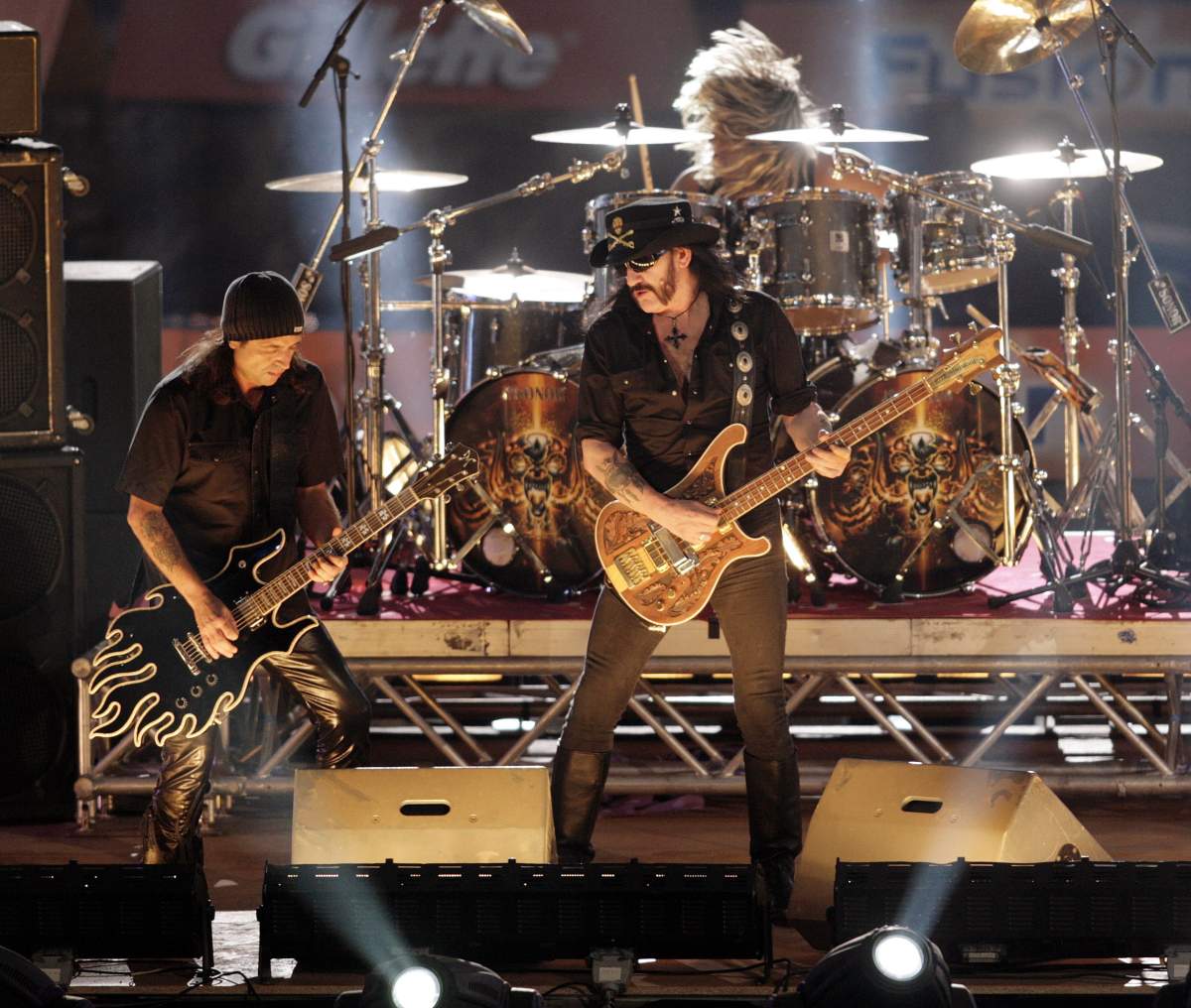 FILE - In this Saturday, Oct. 7, 2006 file photo, rock band Motörhead performs during the show program of the the 'TV total Stock Car Crash Challenge 2006' celebrities race at the Veltins-Arena in Gelsenkirchen, western Germany. The band's Lemmy likes to take credit for the term 'headbanging.'.