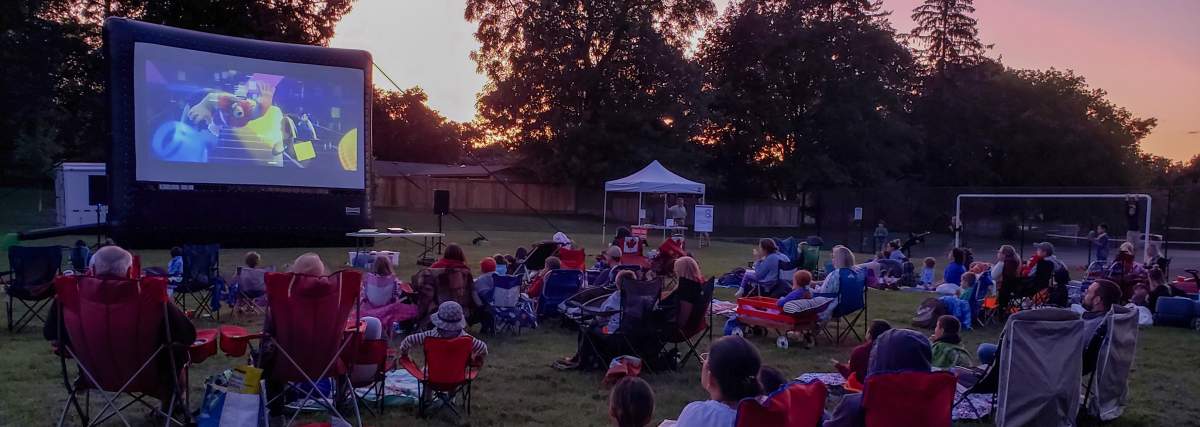 Londoners enjoying a summer movie in the park.