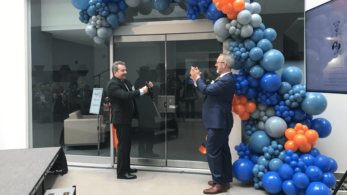 Fusion Pharmaceuticals Inc. chief technology officer Eric Burak and CEO John Valliant cut the ribbon to doors at a new Hamilton manufacturing facility that is producing “targeted alpha therapies” for cancer patients.
