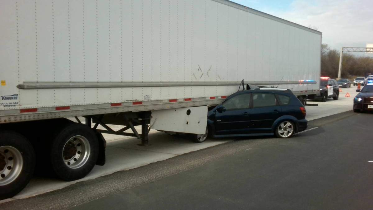 Police are searching for a suspect after a stolen vehicle was recovered from the scene of a collision along Highway 401.