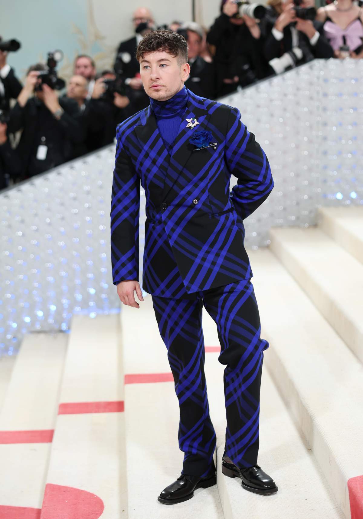 Barry Keoghan wears a blue plaid suit.