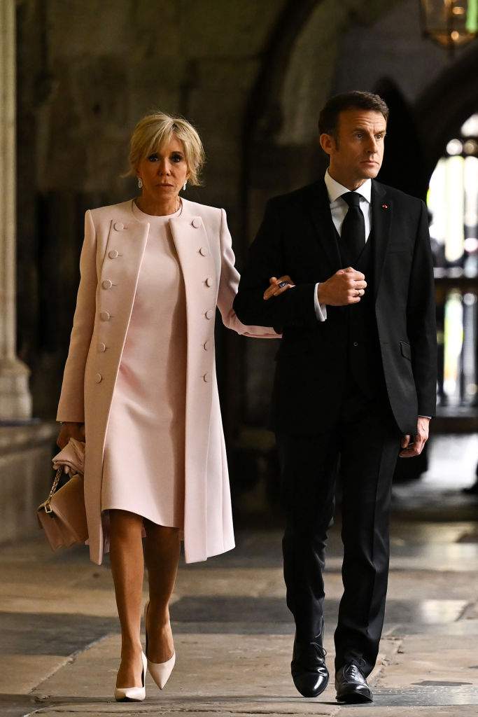 French President Emmanuel Macron and his wife Brigitte Macron arrive to take their seats ahead of the Coronation of King Charles III and Queen Camilla on May 6, 2023 in London, England.