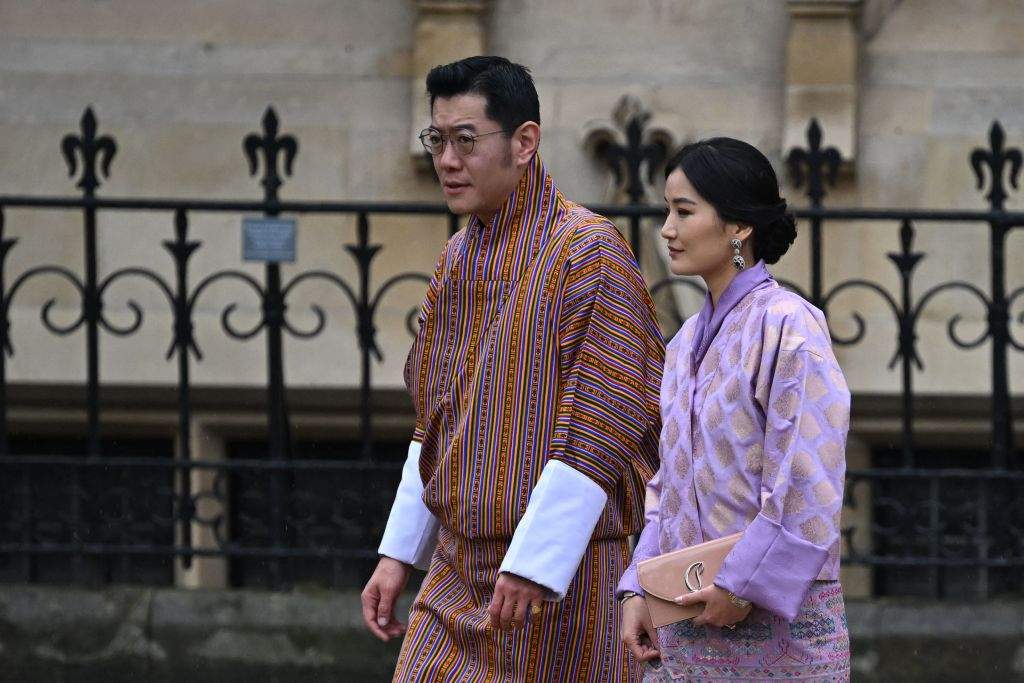 Bhutan's King Jigme Khesar Namgyel Wangchuck and wife Jetsun Pema arrive at Westminster Abbey in central London on May 6, 2023, ahead of the coronations of Britain's King Charles III and Britain's Camilla, Queen Consort.