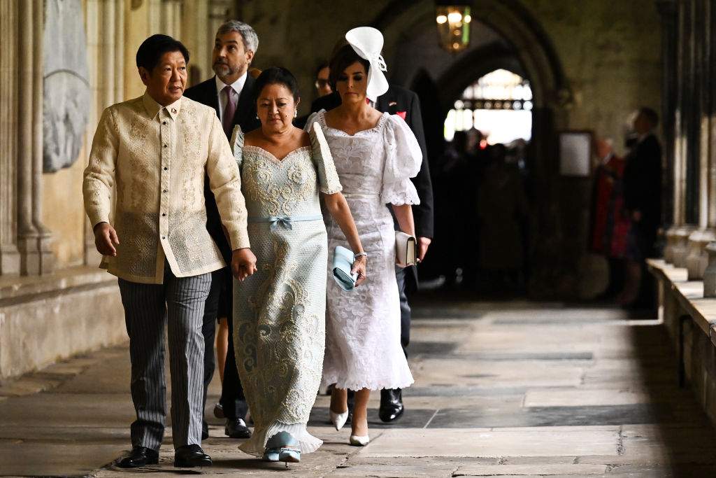 Filipino President Ferdinand Bongbong Marcos (L) and his wife Louise Marcos arrive to take their seats ahead of the Coronation of King Charles III and Queen Camilla on May 6, 2023 in London, England.