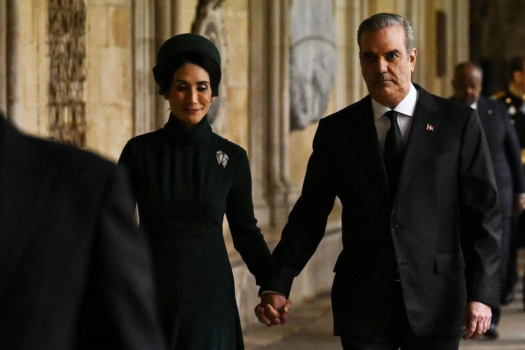 Dominican Republic President Luis Abinader (R) and his wife Raquel Arbaje arrive to take their seats ahead of the Coronation of King Charles III and Queen Camilla on May 6, 2023 in London, England.