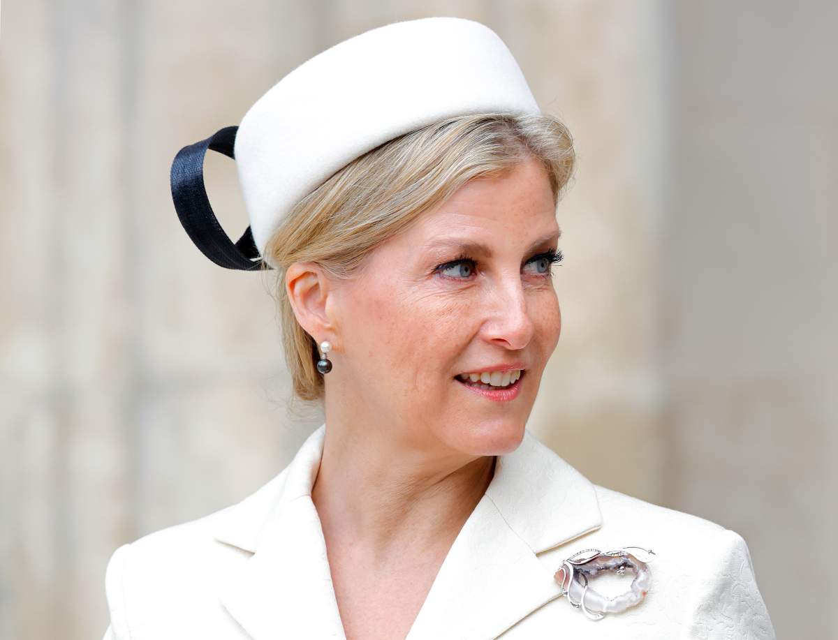 Sophie, Duchess of Edinburgh, in a white cat and white hat. There is a black ribbon on the hat.