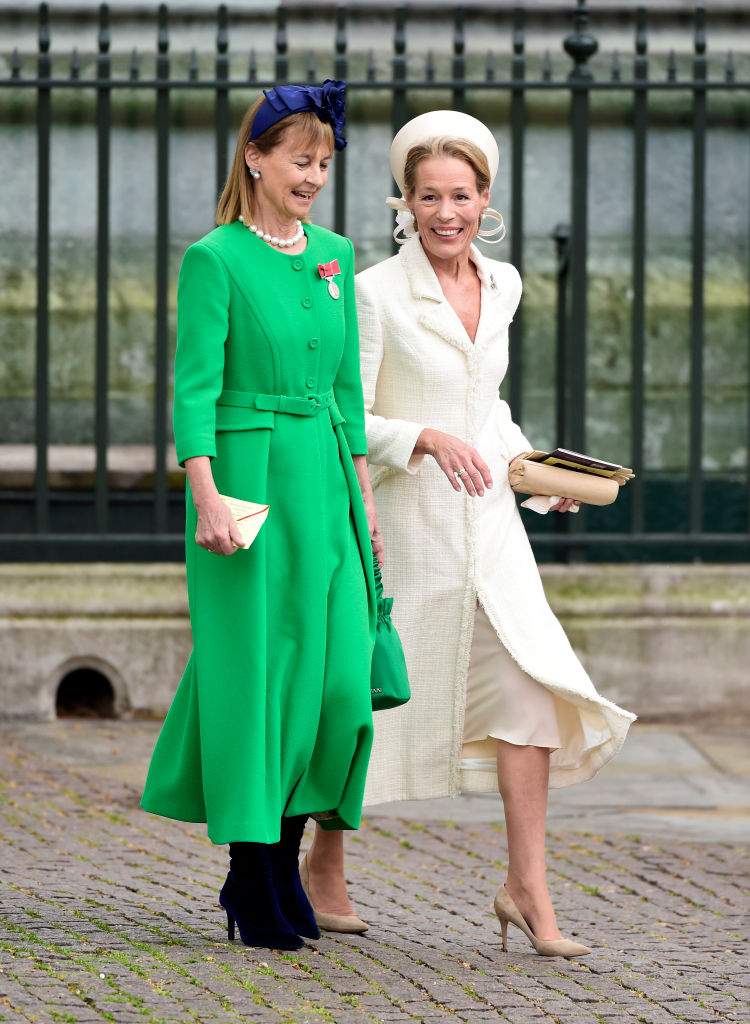 Guests laughing as they arrive in Parliament Square ahead of the Coronation of King Charles III and Queen Camilla on May 06, 2023 in London, England.