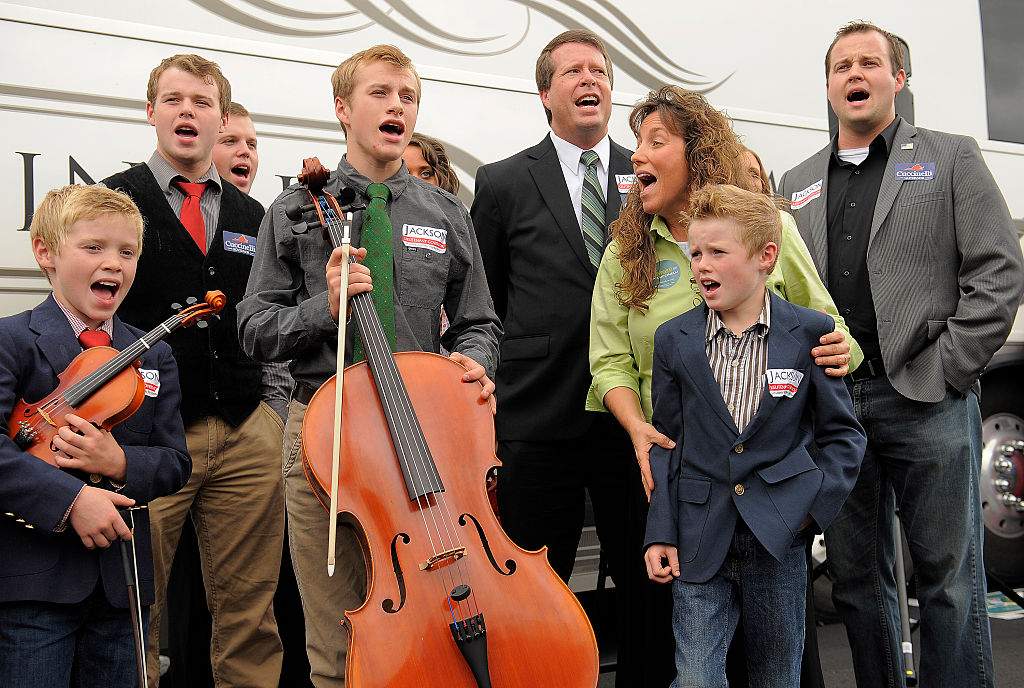 Members of the Duggar family sing as they make a stop on their "Values Bus Tour" outside Heritage Baptist Church on Wednesday October 16, 2013 in Woodbridge, VA.
