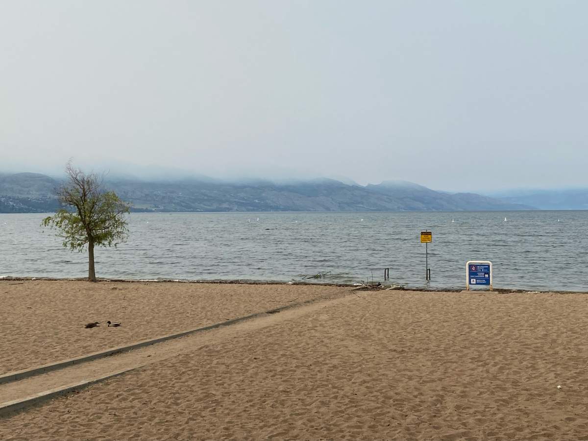 A view of the smoky skies in the Okanagan from a beach in Kelowna, B.C., on Wednesday morning, May 17, 2023.