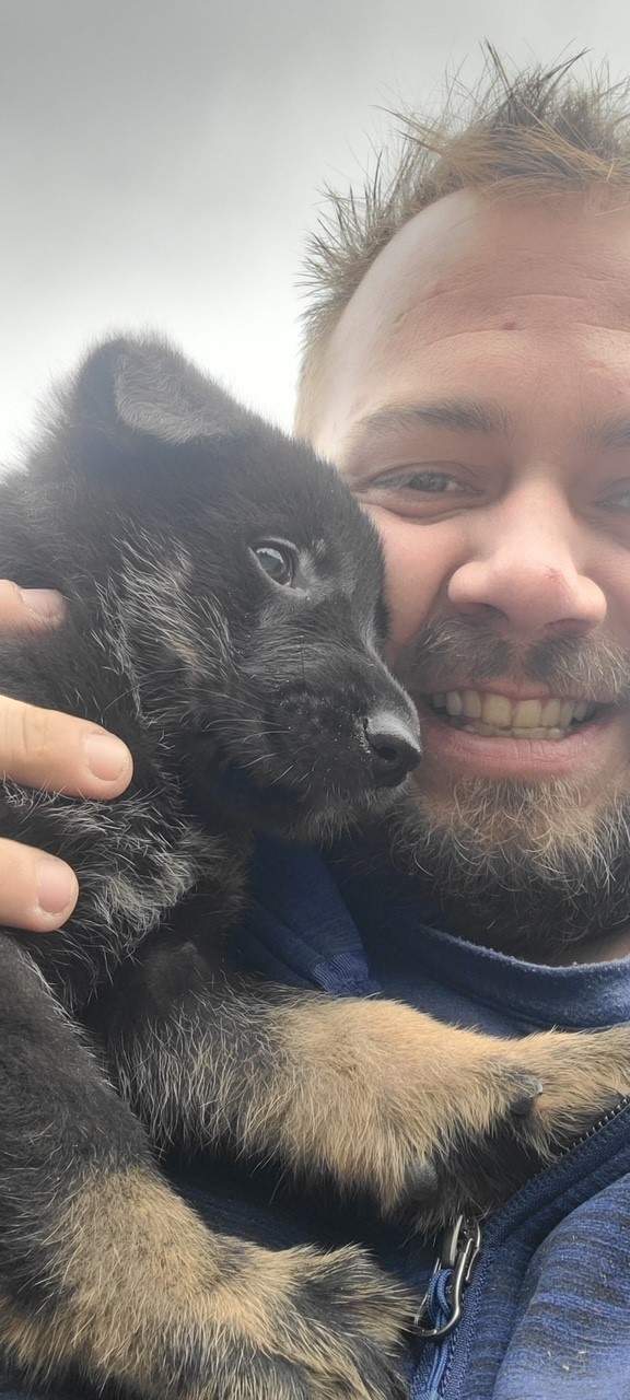 Neil Harvey and his support dog Nash pictured in 2021.