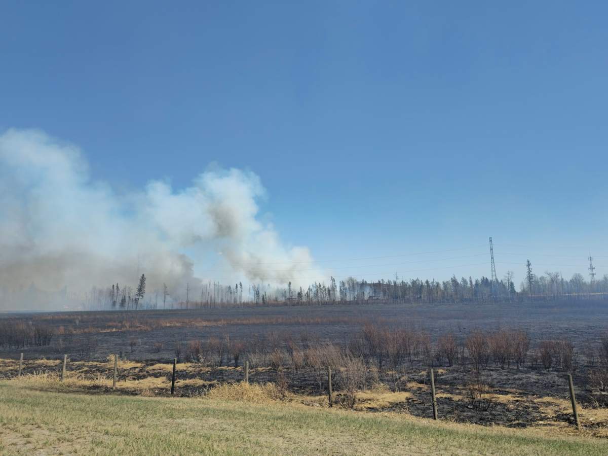 A fire along Anthony Henday Drive in west Edmonton on Thursday, May 4, 2023.