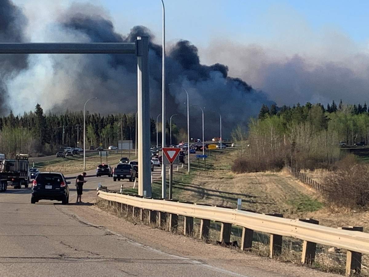 Smoke from a fire is seen near Highway 21 south of Highway 14 in Alberta's Strathcona County on May 5, 2023.