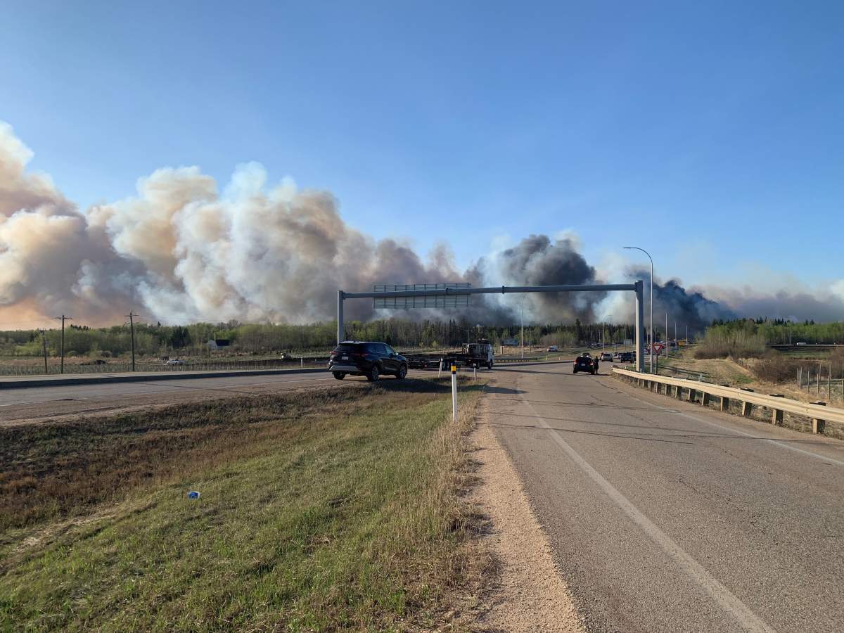 Smoke from a fire is seen near Highway 21 south of Highway 14 in Alberta's Strathcona County on May 5, 2023.