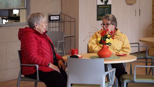 Villagers enjoying a chat in the cafe
