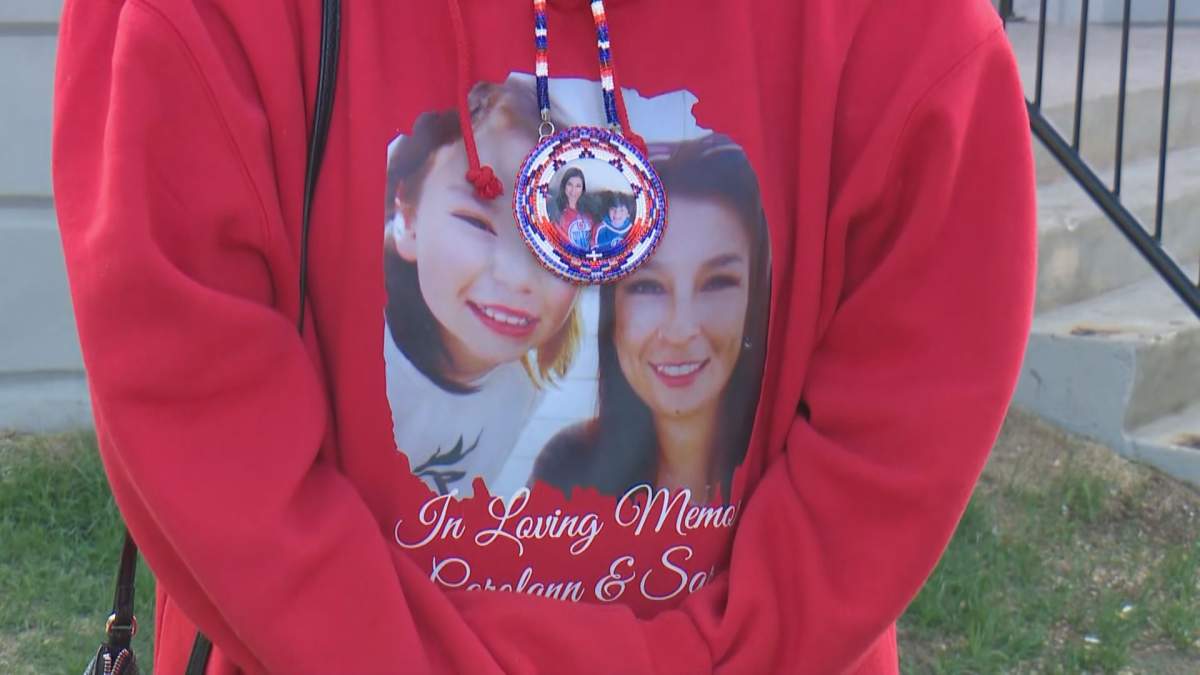 Amanda Robbillard wore a shirt with photos of her sister Carolann Robillard, who was 35, and 11-year-old Sarah Miller, who had recently started using the first name Jayden.