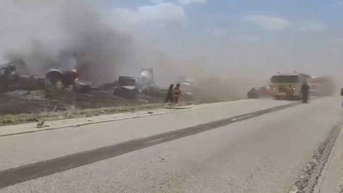 First responders attend the scene of a multi-car pileup on Interstate 55 in Montgomery County, Ill., on May 1, 2023, after high winds kicked up dangerous clouds of dust from nearby farm fields.