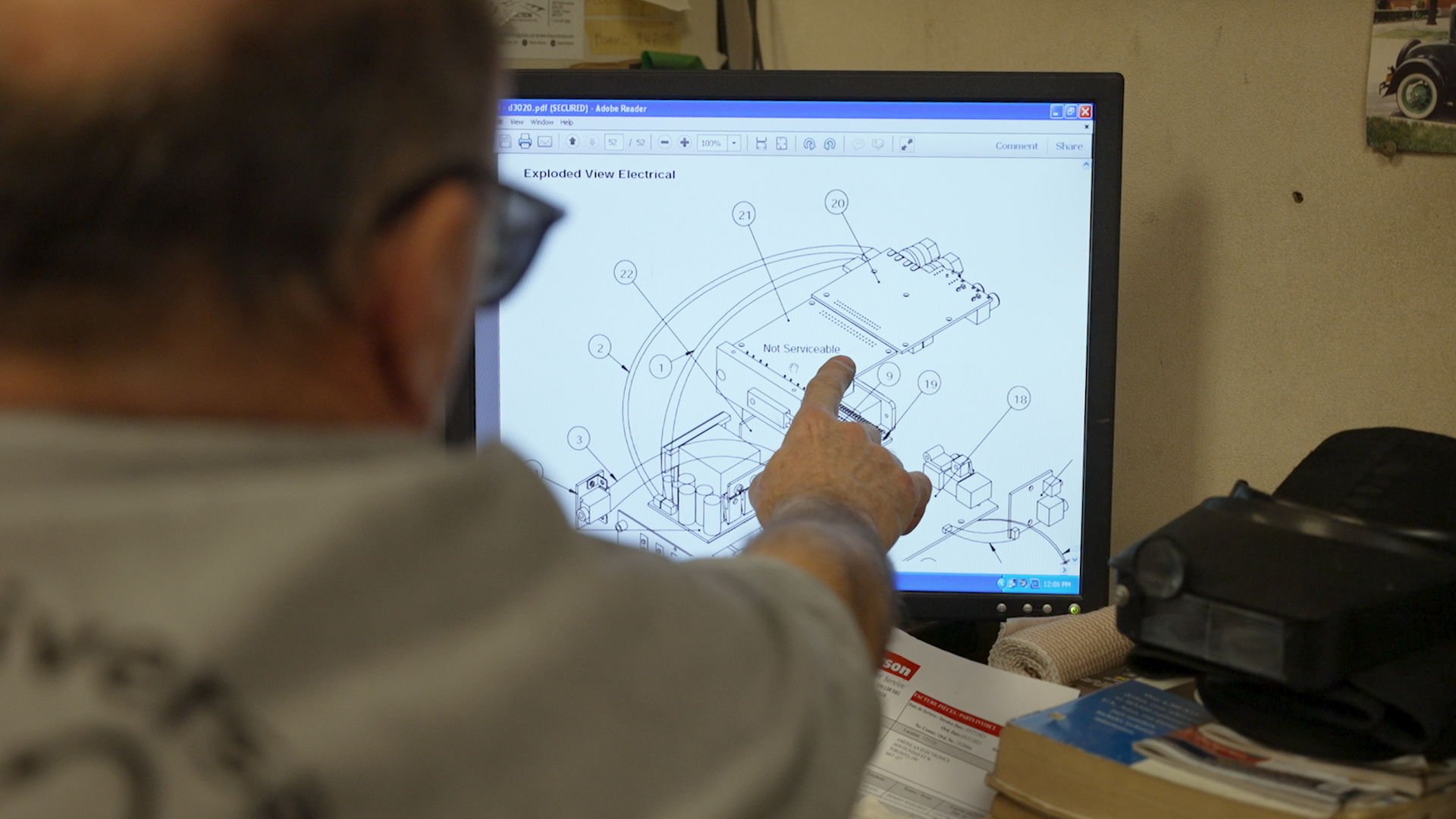 A repair manual for a product has a part labeled “Not Serviceable.” John Fadel says proprietary parts hurt businesses like his.