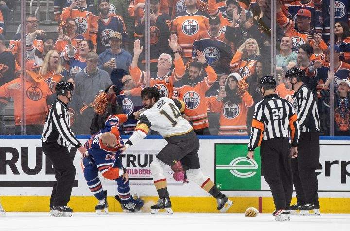 Vegas Golden Knights’ Nicolas Hague (14) and Edmonton Oilers’ Darnell Nurse (25) fight during third period NHL Stanley Cup second round playoff action in Edmonton on Wednesday May 10, 2023.