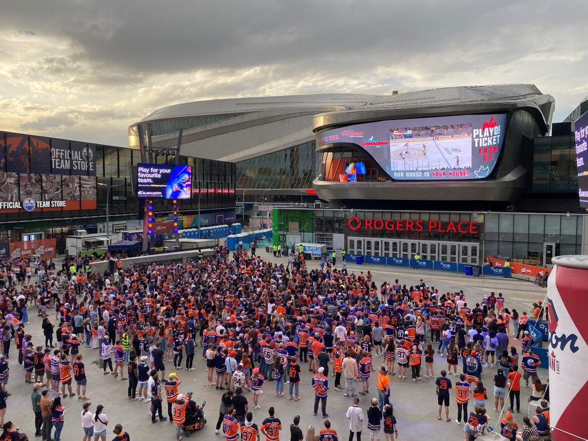 Edmonton Oilers fans watching Game 1 of the Round 2 series against the Vegas Golden Knights in the Ice District plaza at Rogers Place in Edmonton, Alta. on Wednesday, May 3, 2023.