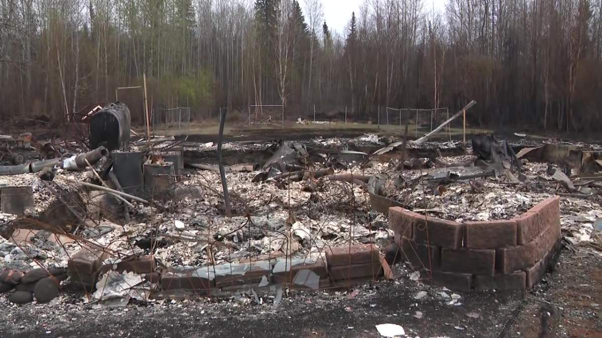 The remains of a house destroyed by wildfire in East Prairie Metis Settlement, Alta. on Friday, May 5, 2023.