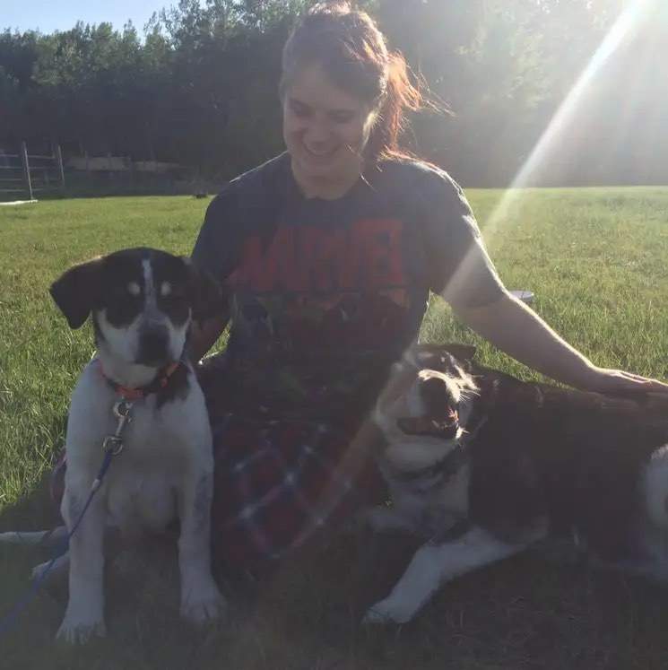 Tiffany and her dog. Jardine family farm in Entwistle, Alta., burned in wildfire on April 29, 2023.