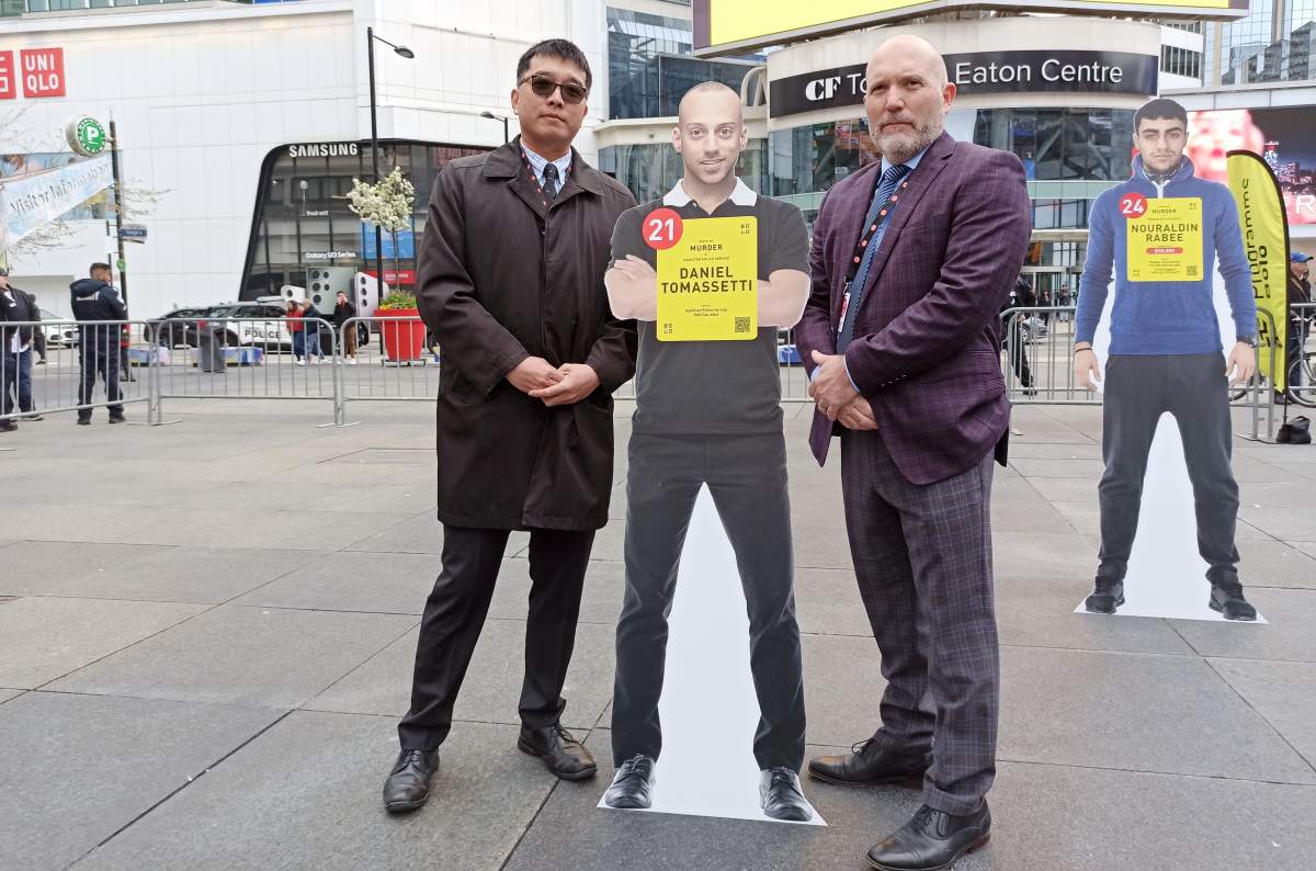 Hamilton police Det. Sgt. Jason Cattle and Insp. Peter Cheung of York Regional Police seen during a press conference in Toronto, May 1, 2023. The two are lead investigators in a joint case seeking suspect Daniel Tomasetti.