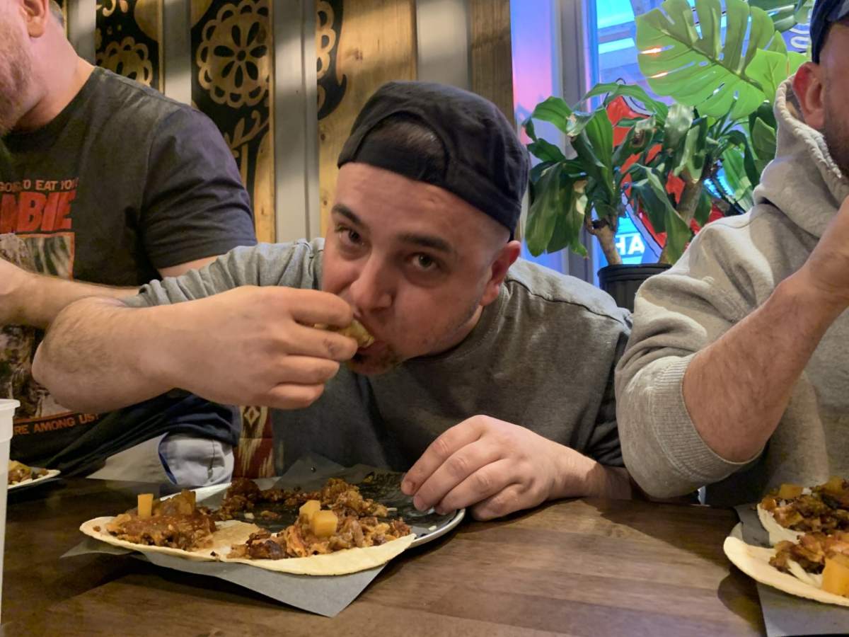 Richard Banman enjoying his tacos as he attempts to secure a first-place finish.