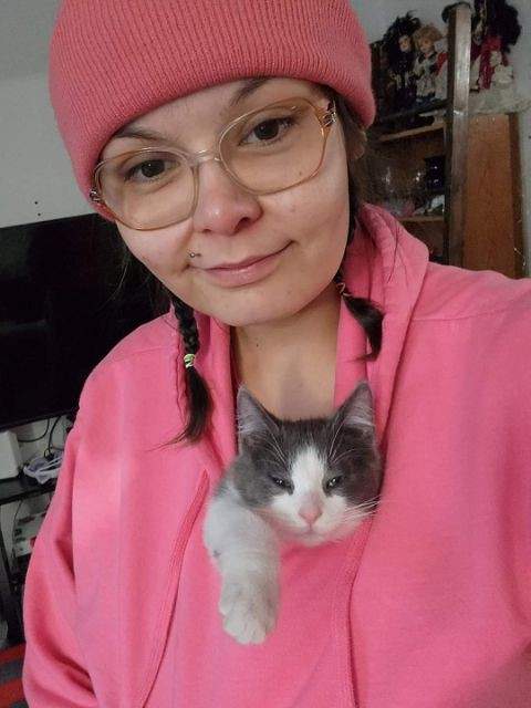 An undated photo of Erica Piche with her cat Cheech at her home in west Edmonton.