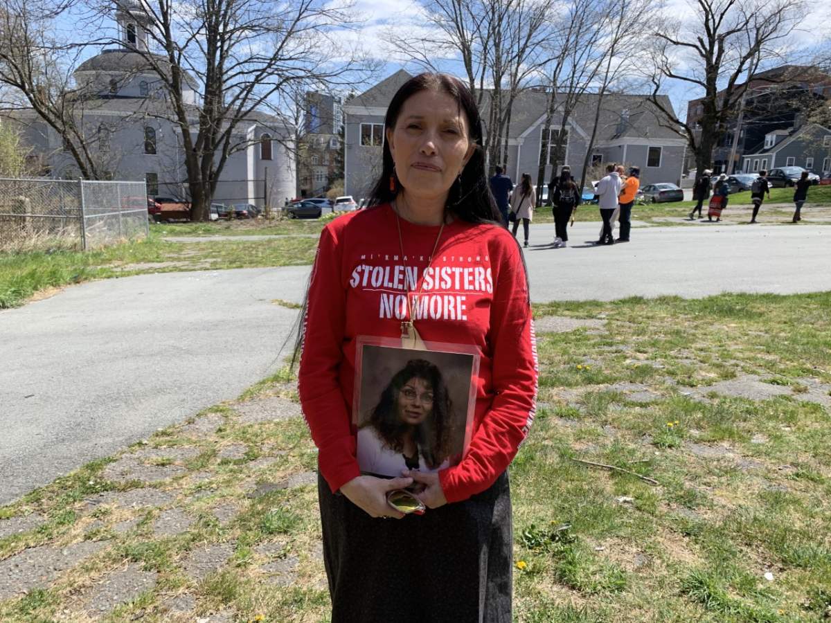 Denise John holds a photo of Tanya Brooks following the special ceremony outside St. Patrick’s-Alexandra School in Halifax on Wednesday afternoon.