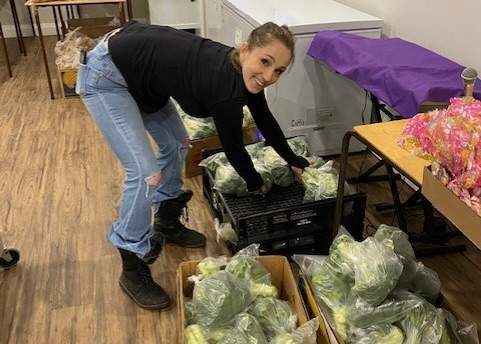 Leah Dyck at the Thornton church packing food on April 5, 2023