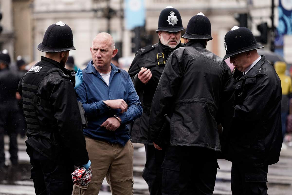 Police arrest an anti-monarchy demonstrators ahead of the procession of Britain’s King Charles III to Westminster Abbey for his coronation in London Saturday, May 6, 2023. (AP Photo/Scott Garfitt)