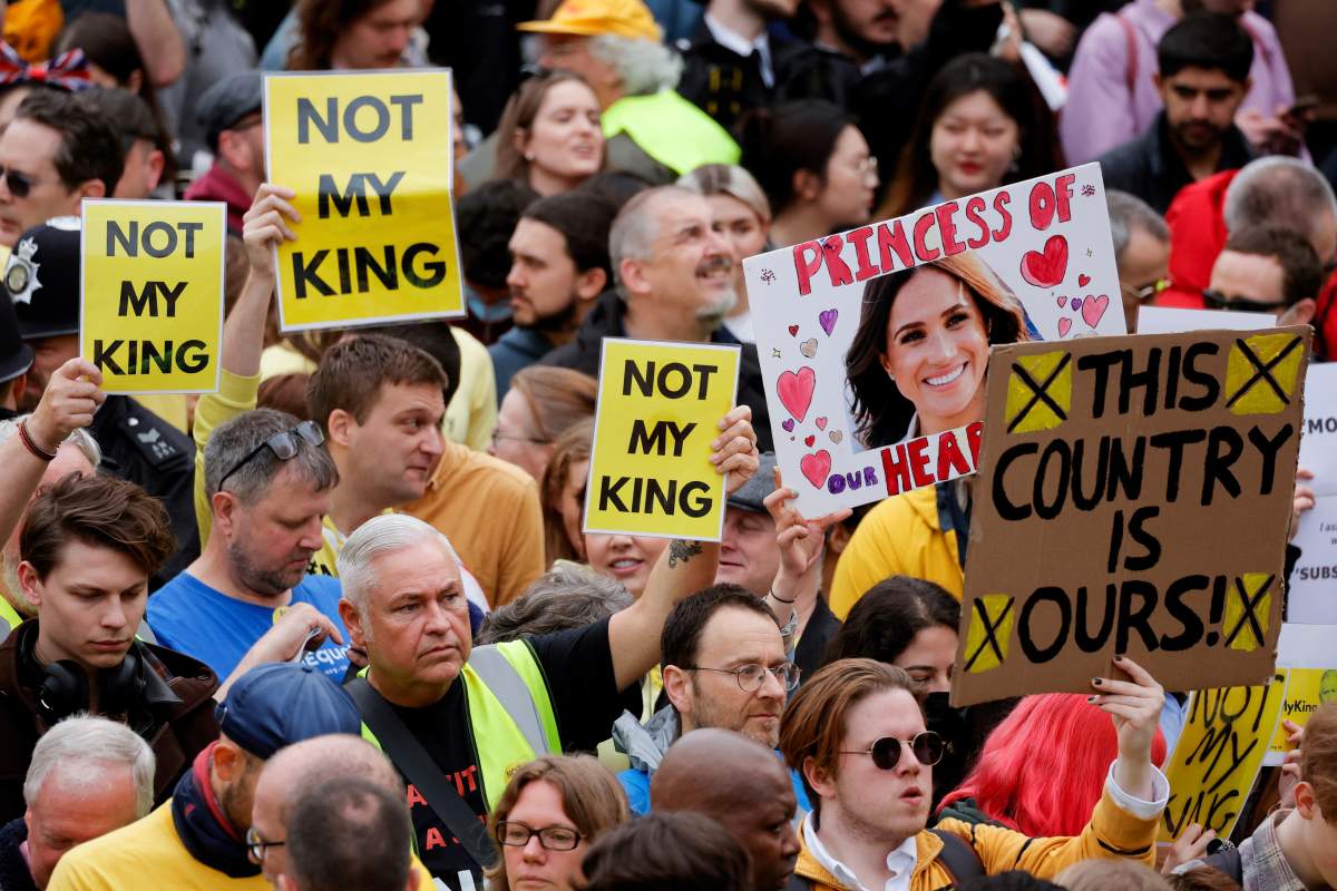 Protesters hold placards ahead of the coronation of Britain’s King Charles III in London Saturday, May 6, 2023. Saturday, May 6, 2023. (Piroschka van de Wouw/Pool via AP)