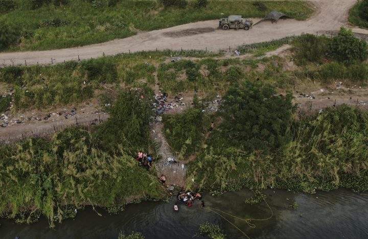 Migrants cross the Rio Grande river into the United States from Matamoros, Mexico, Wednesday, May 10, 2023.
