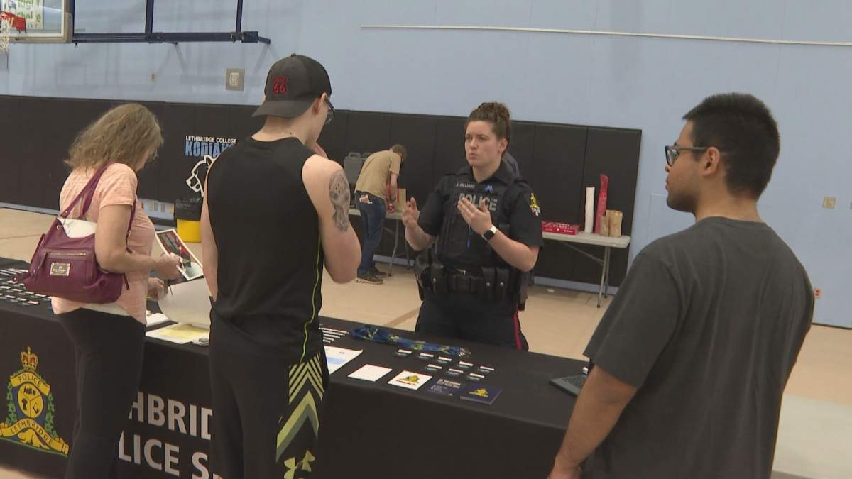 Cst. Allison Williams with the Lethbridge Police Service speaks with attendees at Friday's career event at Lethbridge College.
