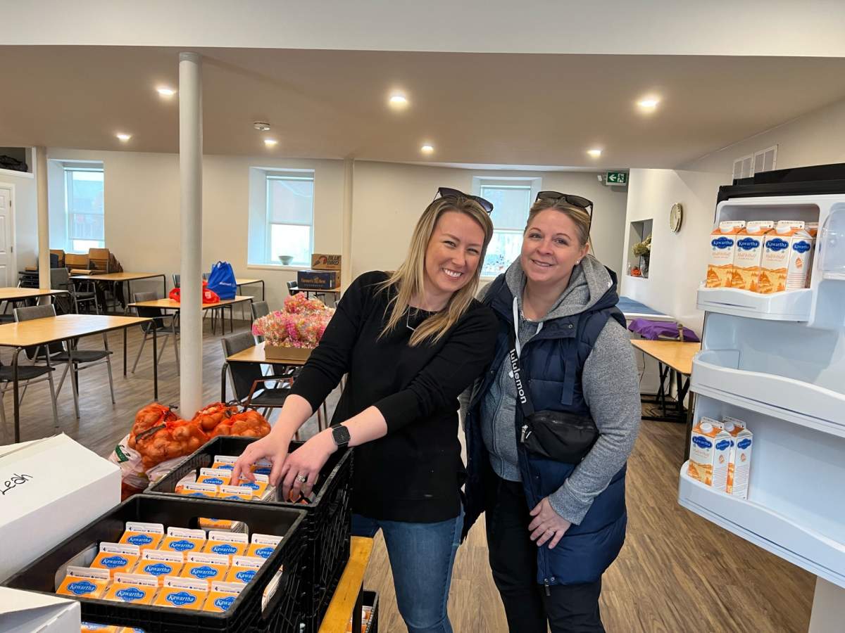 April 4 at the Thornton church, (L) Amy Simpson and (R) Ashleigh Hrynyk, co-founders of the 100 Women Who Care South Simcoe branch, donate $1,120 to Fresh Food Weekly for Easter.