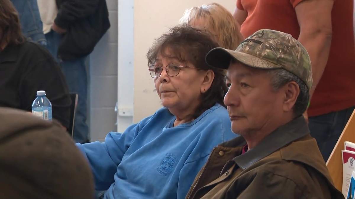 Carol Johnston listening at a community update after a wildfire tore through her community of East Prairie Métis Settlement in Alberta in early May 2023.