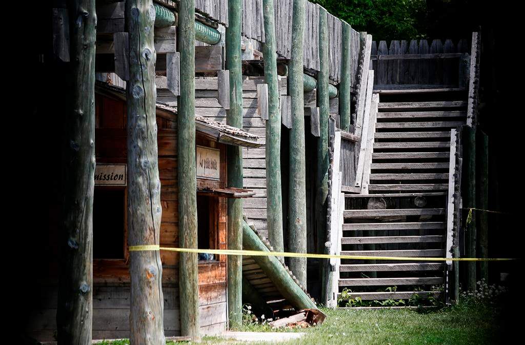 Two sections of a collapsed walkway are shown behind tape at Fort Gibraltar in Winnipeg, Wednesday, May 31, 2023.